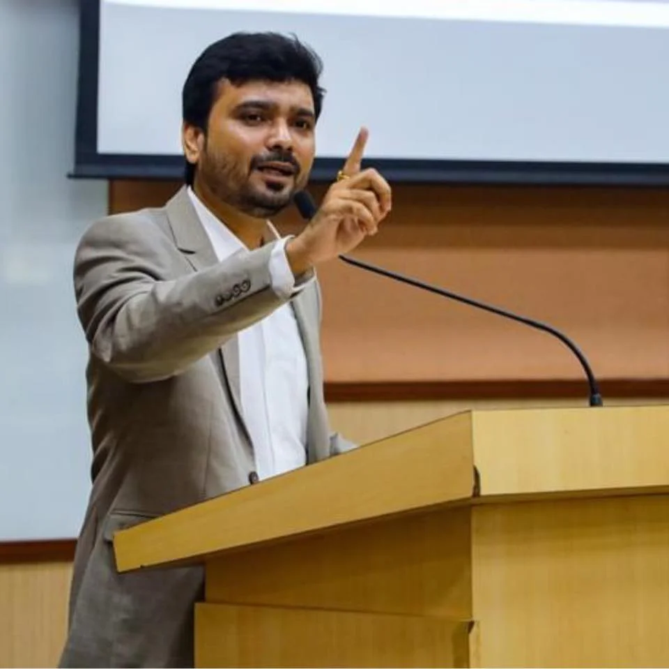 Avinash Chate, founder of ABC Trainings, speaking at a lectern